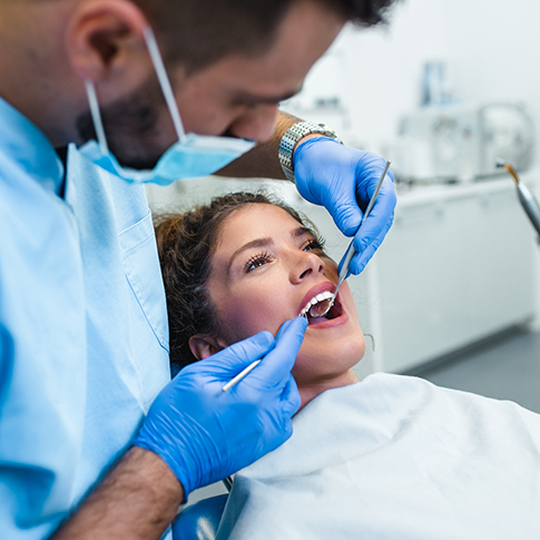 Woman getting a dental exam