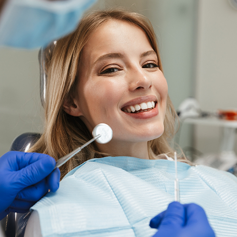 Smiling woman in the dental chair