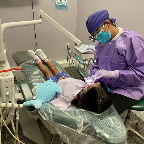 Doctor Dhaliwal treating a child patient