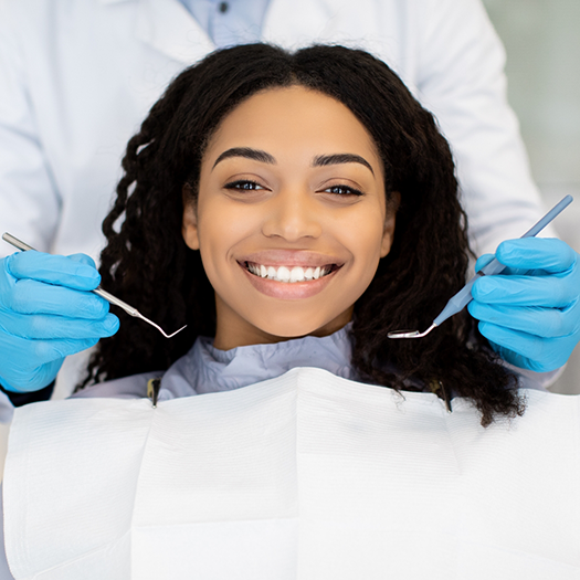 Woman smiling during her dental checkup
