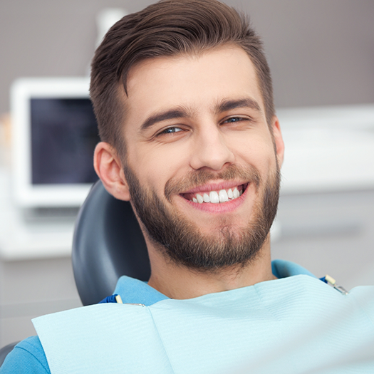 Young man smiling in the dental chair